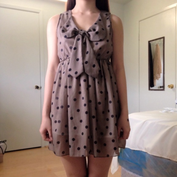 Tan polka dot dress with ribbon.