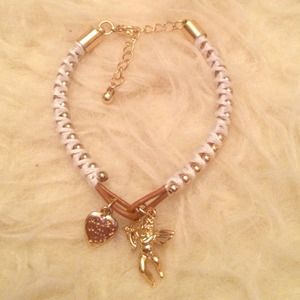 white bracelet with angel charm