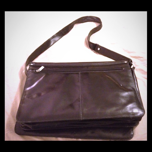 Black leather messenger bag. Used twice.