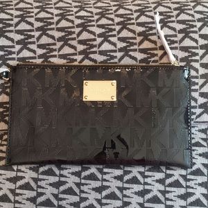 MK metallic zip clutch