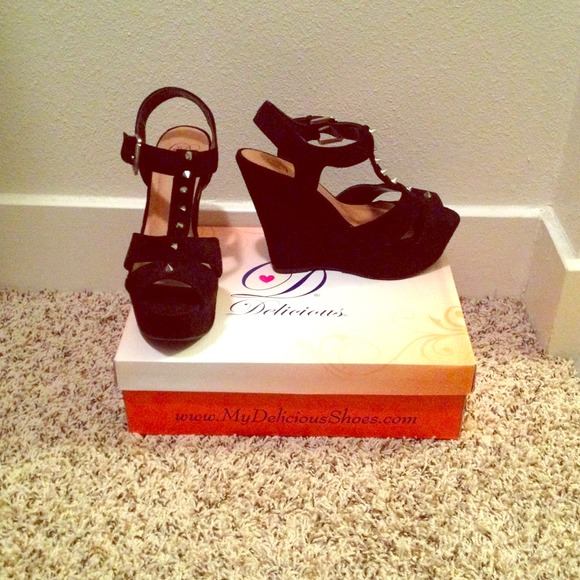 Black spiked wedges. Never been worn!