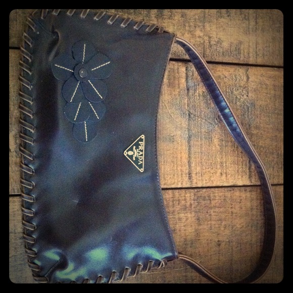 Purse with Prada tag on front.