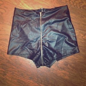 Black leatherette high waisted shorts.