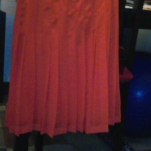 Orange pleated skirt