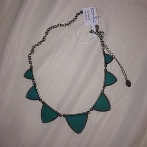 Brassy gold necklace with teal stones.