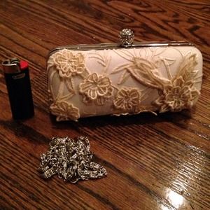 Evening clutch with jeweled clasp and appliqué 🌸