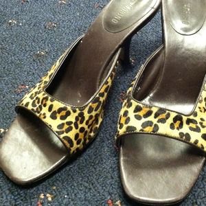 Leather upper, leopard print sandals.