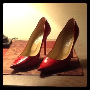 Jimmy Choo red pumps and Louis Vuitton purse