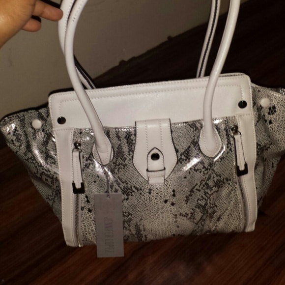 White and silver jennifer lopez handbag.
