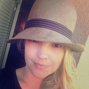 Brown straw cloche-style hat.