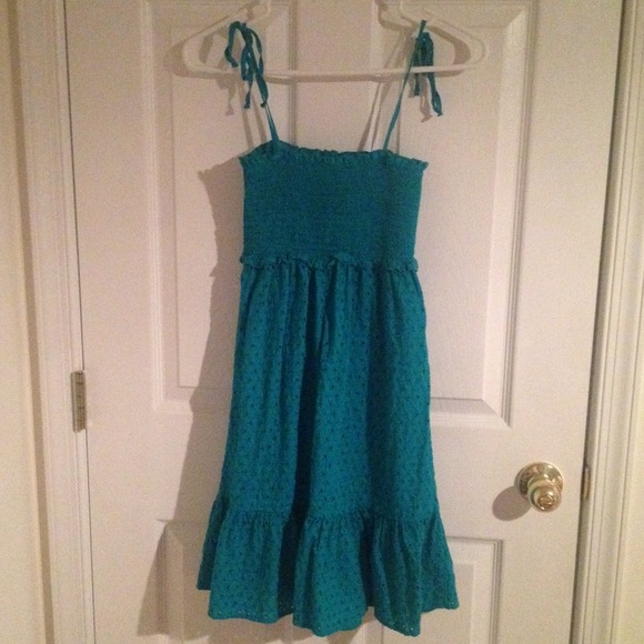 A green eyelet swimsuit cover up