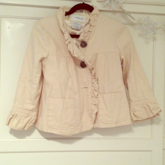 Tan, ruffle trim jacket by the brand weatherproof
