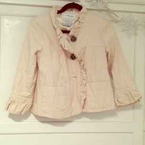 Tan, ruffle trim jacket by the brand weatherproof
