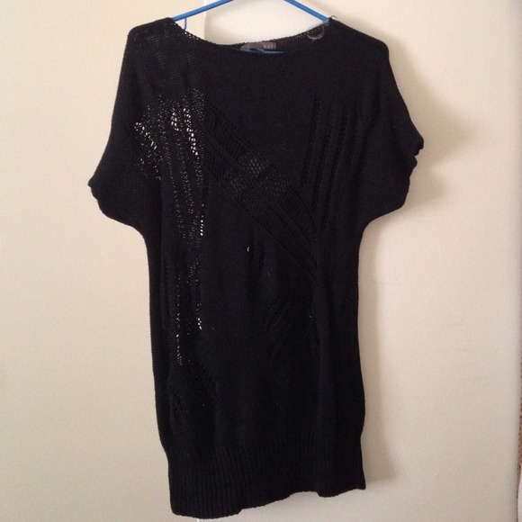 Hole-y knitted shirt.