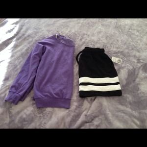 Purple cloth with soft nap. Black and white skirt.