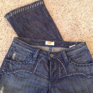 Distressed denim jeans