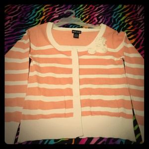 This is a peach colored cardigan. Never been worn.