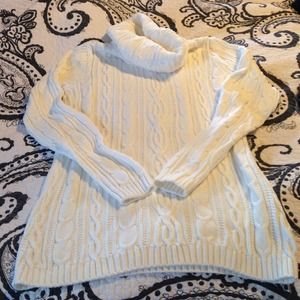 White cable knit sweater.