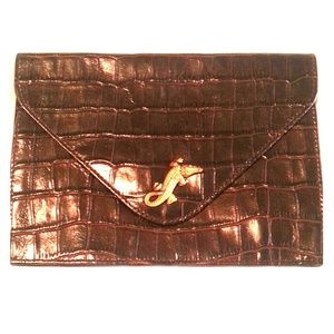 Brown leather clutch with alligator accent