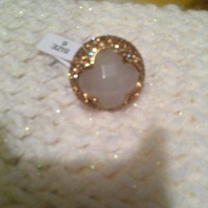 Cute ring with a white stone in the middle