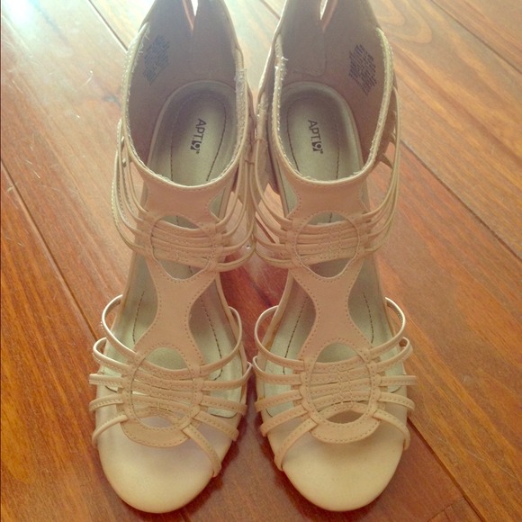 Nude leather cutout heels.