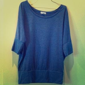 2 bat wing style tops and distressed jeans.