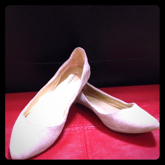 Suede tan flats .