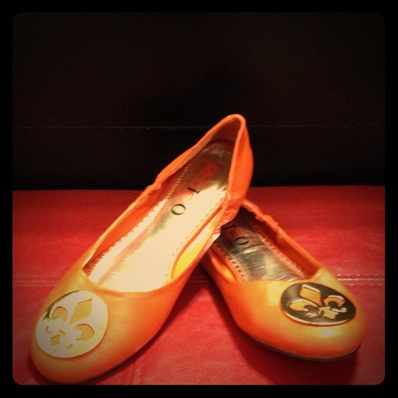 Burnt orange flats .