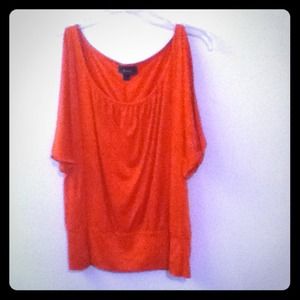 Red cut out shirt. Actually it's a little peachy.