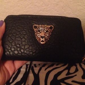 Black leather with Cheetah fAce on front wallet