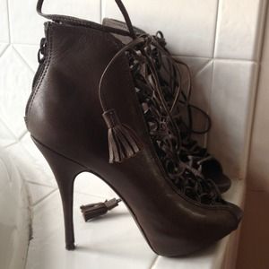 Good condition high heeled sandals in taupe color.