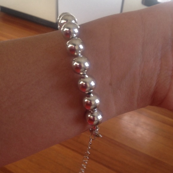 Silver bracelet by Estée Lauder brand new