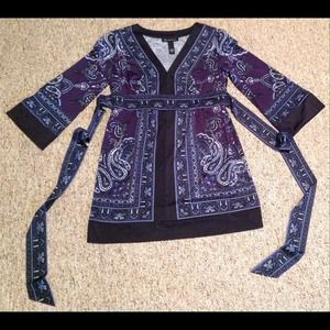 Black and Blue INC longer top with attached belt.