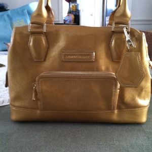 A gold longchamp medium shopper