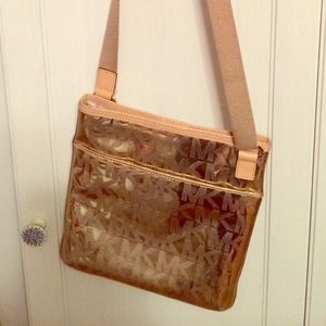 Gold metallic cross body Michael kors bag.