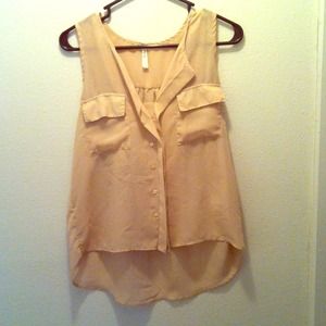 Sheer nude shirt with two pockets on each side.