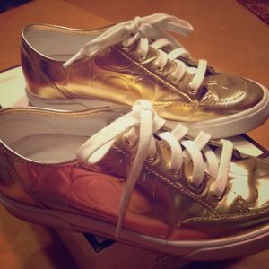 Gold metallic COACH sneakers