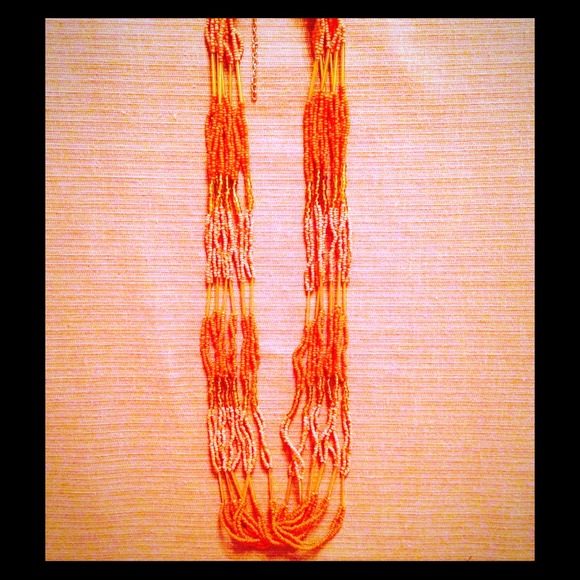 Orange pink and gold long necklace.