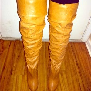 Above the knee light brown leather boots