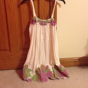 a short white dress with floral