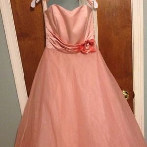 Full length pink gown with a full skirt.