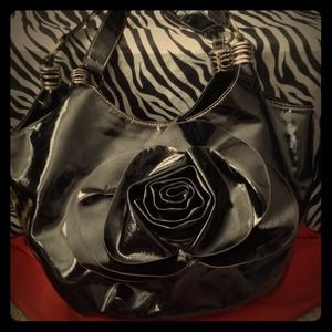 Black vinyl tote with rosette detail