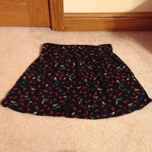 short black flared skirt with colored triangles.