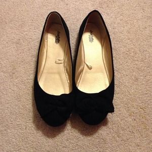 black flats with bows on the toe.