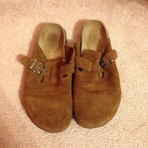tan slip ons with gold buckle with cork sole.