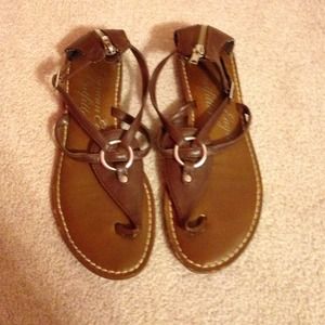 brown sandals, silver buckle and zipper in back.