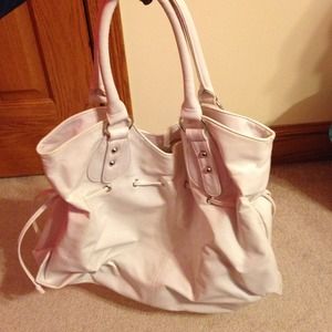 white pleather large bag with silver accessories.