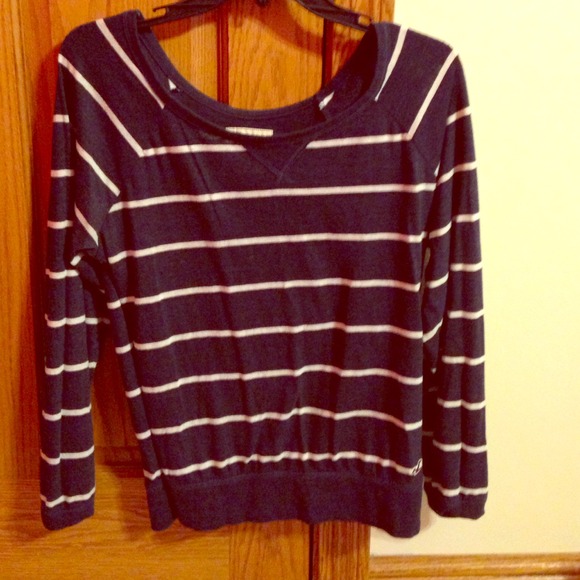 long sleeve blue and white striped shirt.