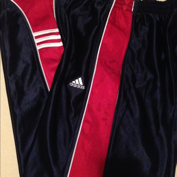 Adidas track pants. Snap on/off top to bottom.