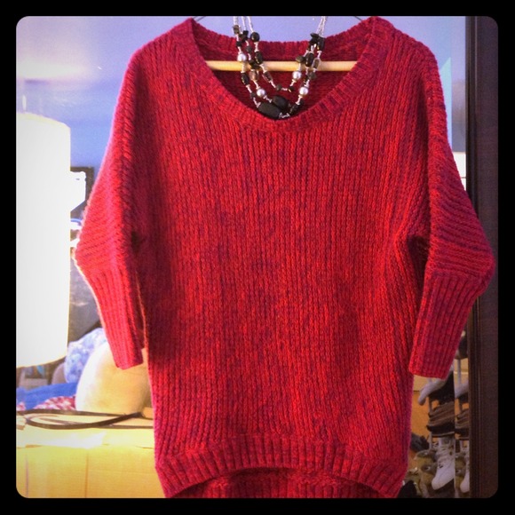 Pink sweater with purple accents